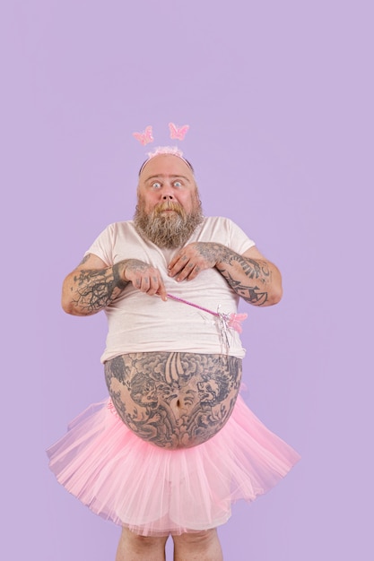 Premium Photo | Shocked bearded man with overweight in fairy costume on ...