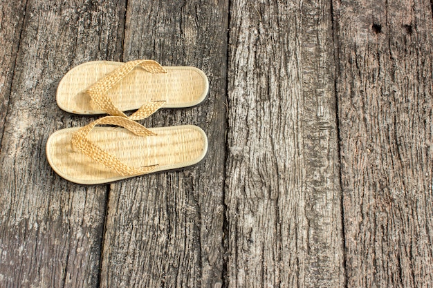 Shoe Weave In Front Of The Hotel Room On The Old Wood