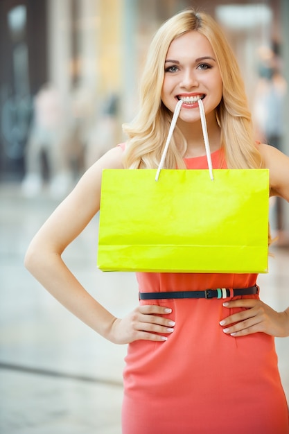 Premium Photo | Shopping is fun. beautiful young woman holding shopping ...