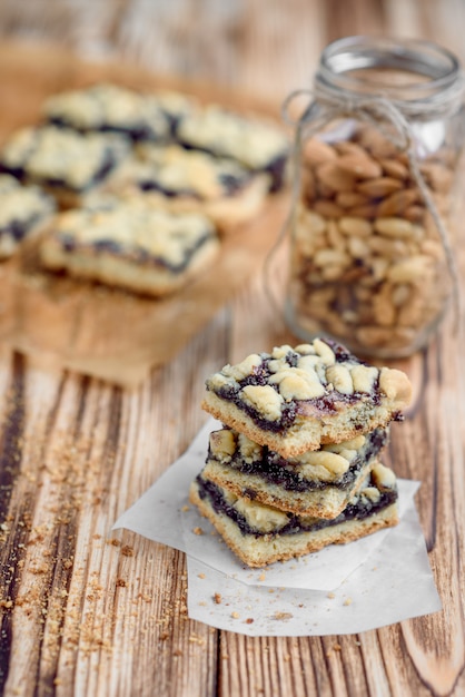 Premium Photo | Shortbread cookies with blueberry jam on baking paper ...