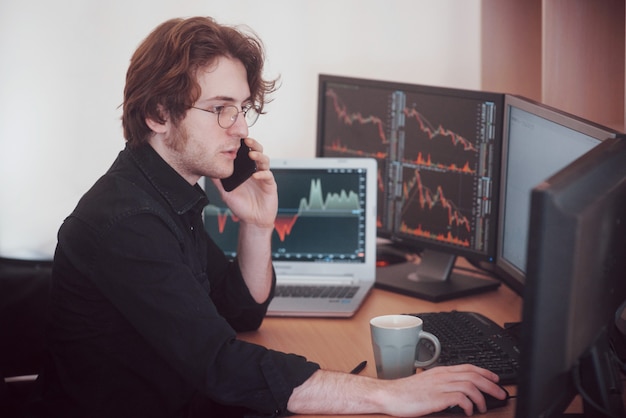 Over The Shoulder View Of And Stock Broker Trading Online While