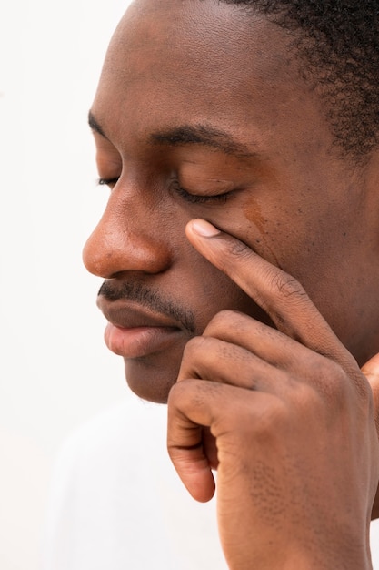 Free Photo | Side view of black man crying