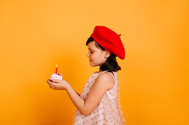 Free Photo Side View Of Child Holding Cake With Candle French Kid Celebrating Birthday