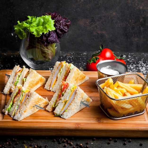Free Photo | Side view club sandwich with sauce ketchup and mayonnaise ...