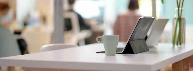 Premium Photo Side View Of Comfortable Office Desk With Laptop Tablet Mug And Decoration