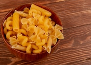 Free Photo Side View Of Different Types Of Macaroni In Bowl On Wooden 
