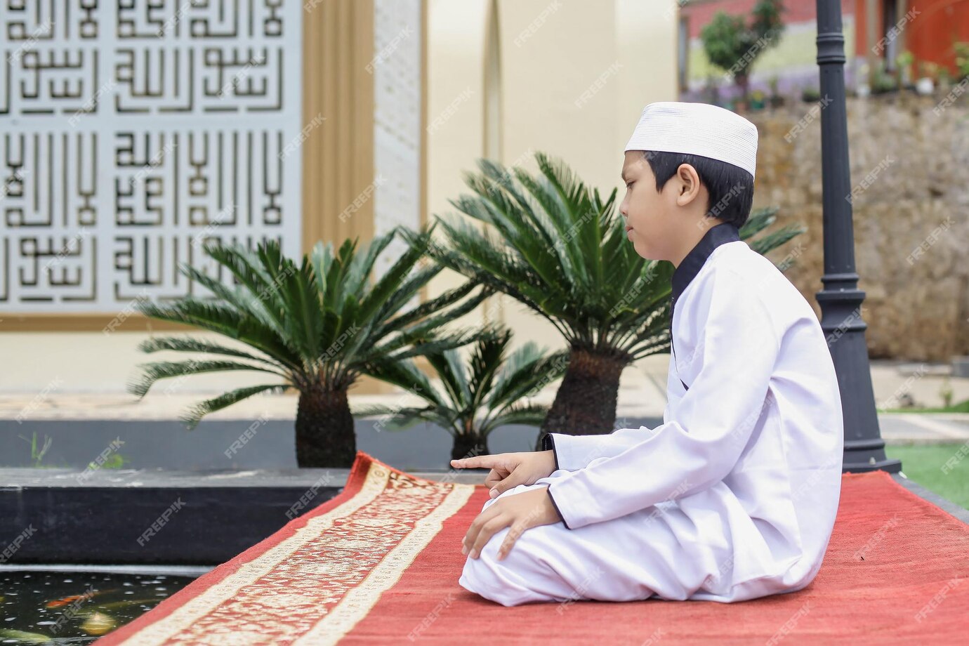 Premium Photo | Side view of islamic boarding school student doing ...