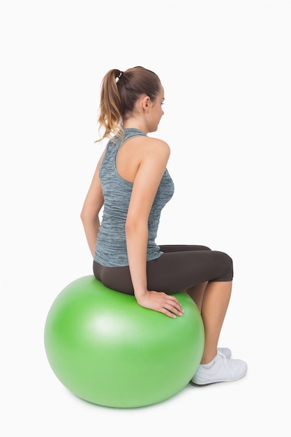 sitting on fitness ball