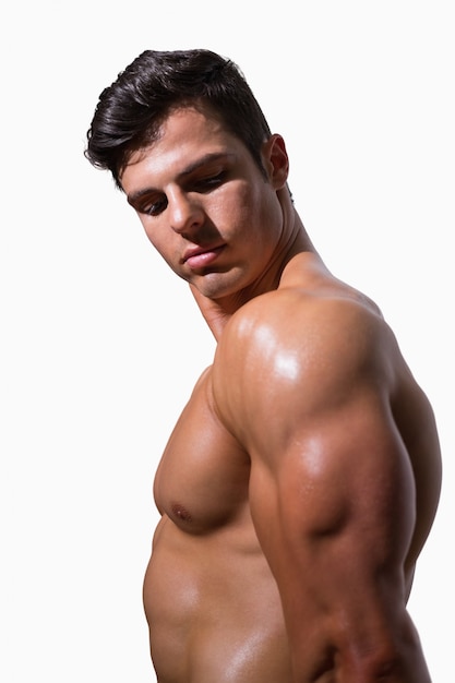 Premium Photo Side View Of A Shirtless Muscular Man