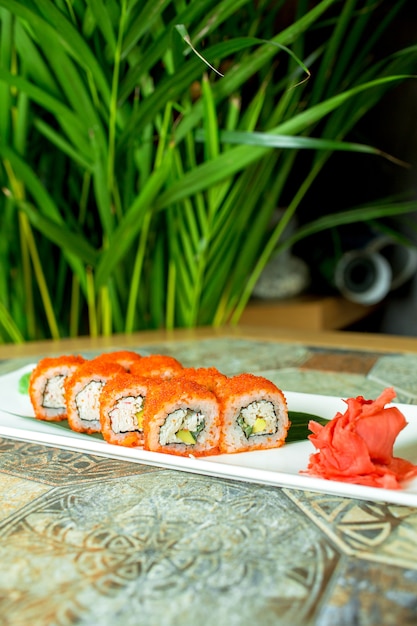 Free Photo | Side view of sushi set rolls with crab meat cream cheese ...