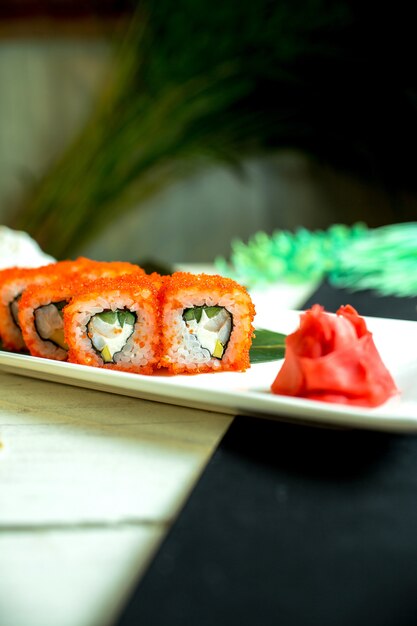 Free Photo | Side view of sushi set rolls with crab meat cream cheese ...