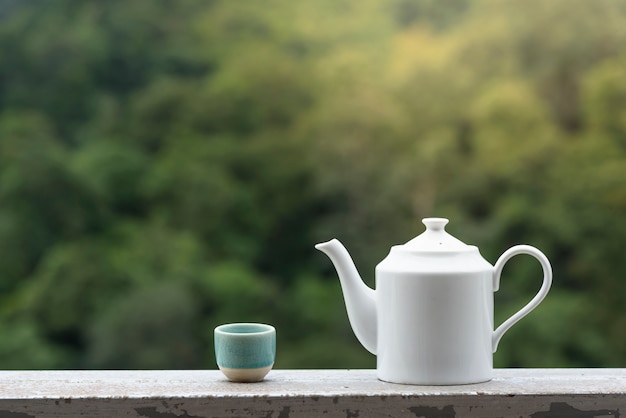Premium Photo | Side view of a tea pot at tea plant.