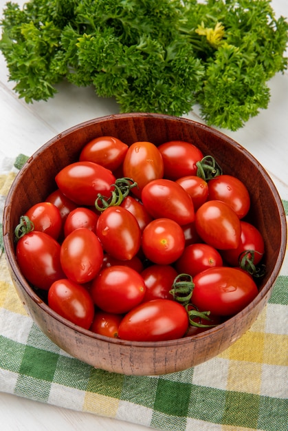 Free Photo | Side view of tomatoes in bowl on cloth with chinese ...