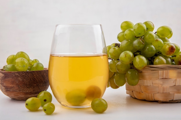 Free Photo | Side view of white grape juice in glass with white grape