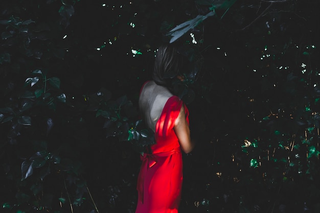 Free Photo | Side view woman standing in shadow