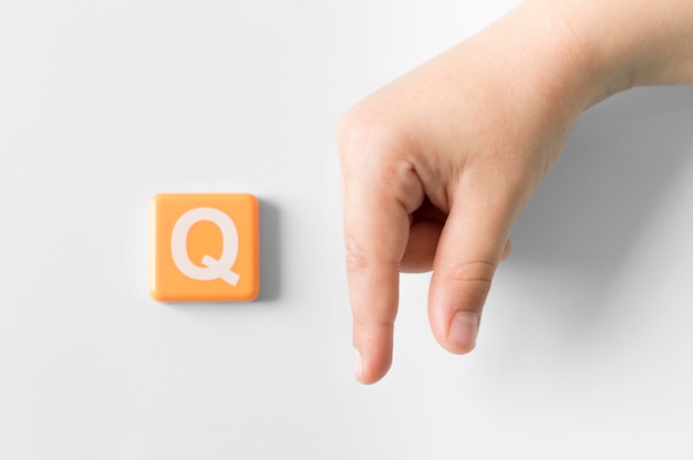 sign-language-hand-showing-letter-q-free-photo