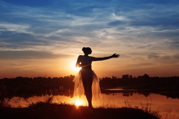 Premium Photo | Silhouette of a ballet dancer at sunset outdoors