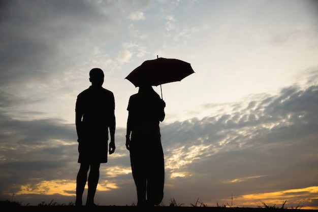 Premium Photo | Silhouette of a couple with arguing in the sunset ...