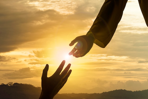 Premium Photo | Silhouette of jesus giving helping hand