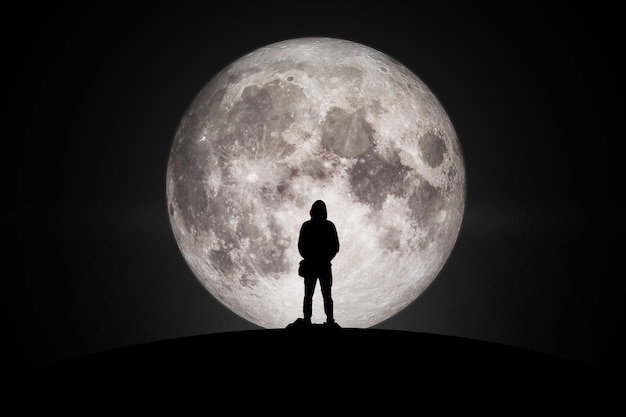 Premium Photo | Silhouette of man looking at the moon with hope ...