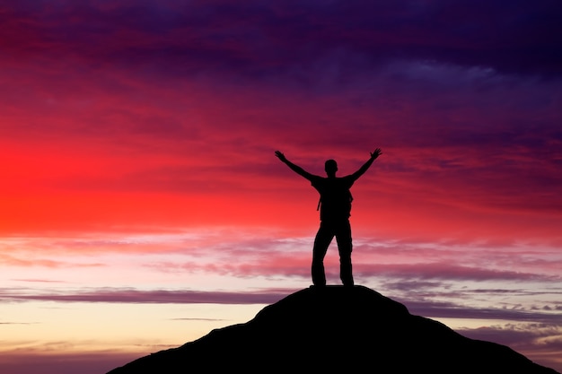 Premium Photo | Silhouette of a man on a mountain top. person ...