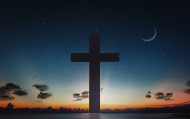 十字架のシルエットは 夕日と夜の空の月の背景でクロスします プレミアム写真