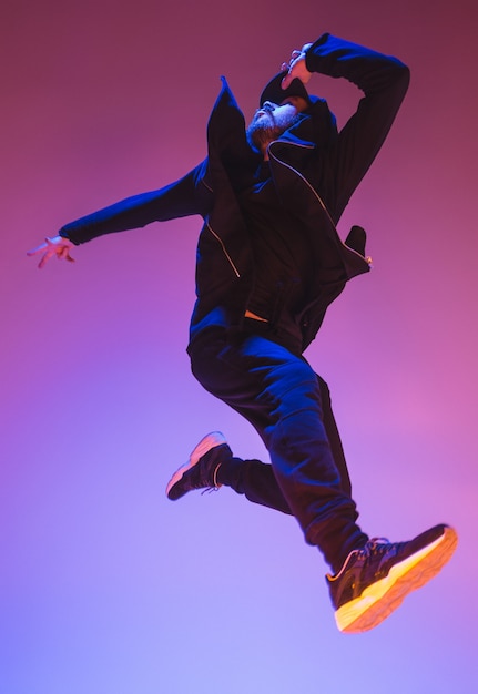 Premium Photo | The silhouette of one young hip hop male break dancer ...