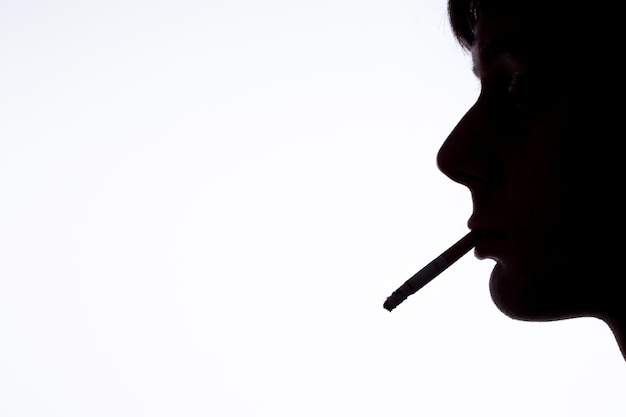 Premium Photo | Silhouette of smoking man