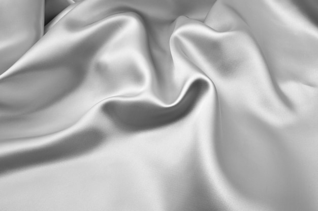 銀色の波状シルク背景テクスチャ プレミアム写真