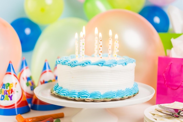 Premium Photo | Simple white birthday cake with cake candles.