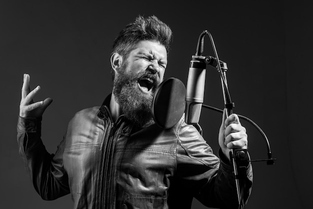 Premium Photo | Singing man in a recording studio expressive bearded ...