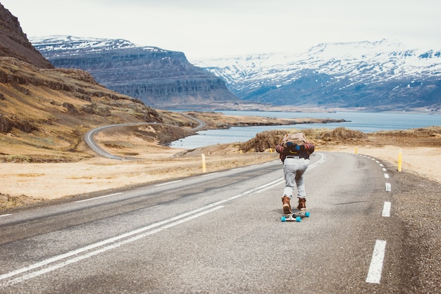 Premium Photo Skater Traveling Iceland On His Longboard