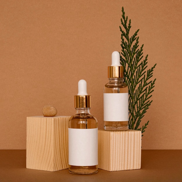 Skin oil droppers assortment with wooden pieces Free Photo