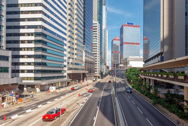 Premium Photo | Skyscrapers and road, hong kong city view.