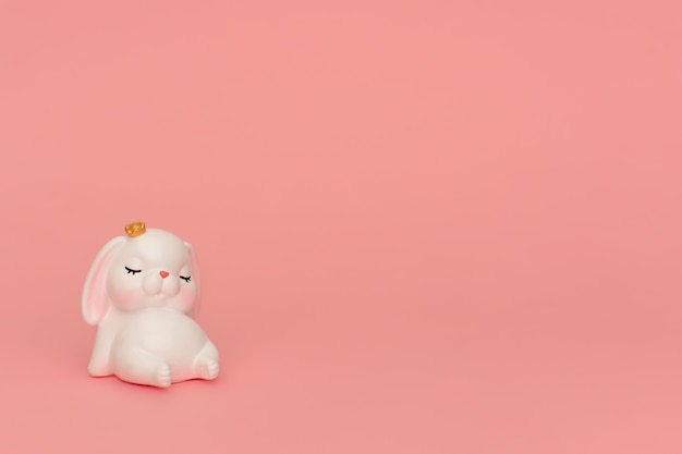 Premium Photo Sleeping Cute Bunny Rabbit In A Crown On A Pink Background White Mascot Toy Sleepy Bunny With Pink Ears Sit On Pink Wall