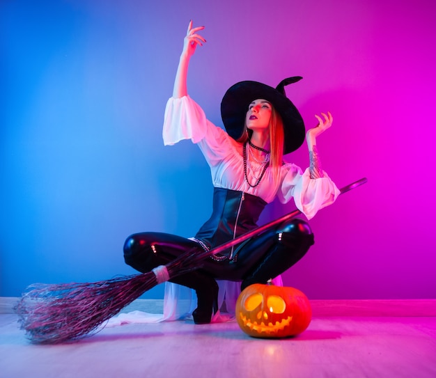 Premium Photo The Slender Girl In A Witch Costume For Halloween With