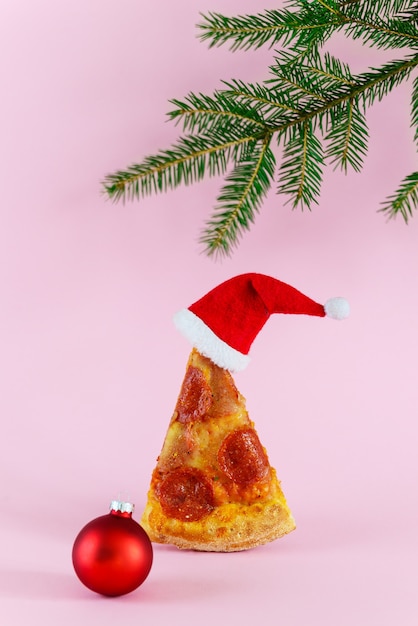 Premium Photo | A slice of pepperoni pizza in the form of a christmas ...