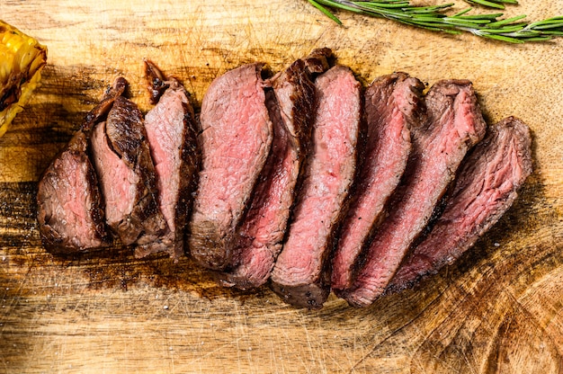 Premium Photo Sliced Grilled Filet Mignon Steak On A Wooden Chopping