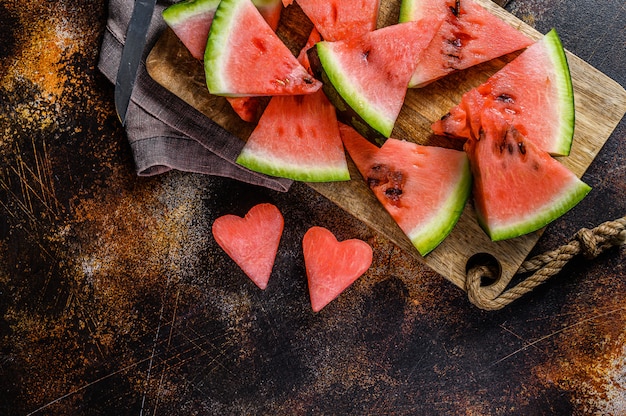 Premium Photo | Slices of ripe watermelon in the shape of a heart. the ...