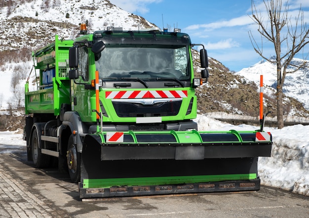 Premium Photo | Small green truck using snow plow