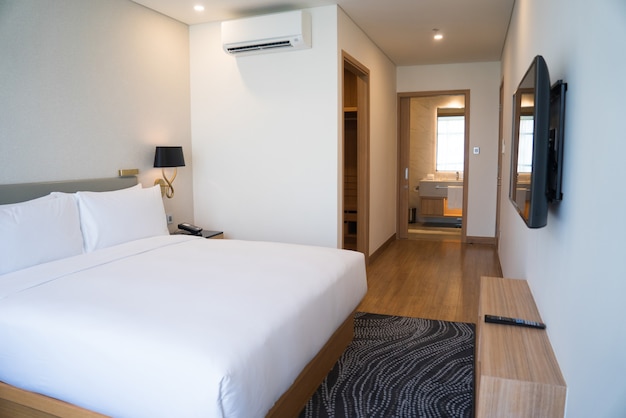 Download Free Photo | Small hotel room interior with double bed and bathroom.