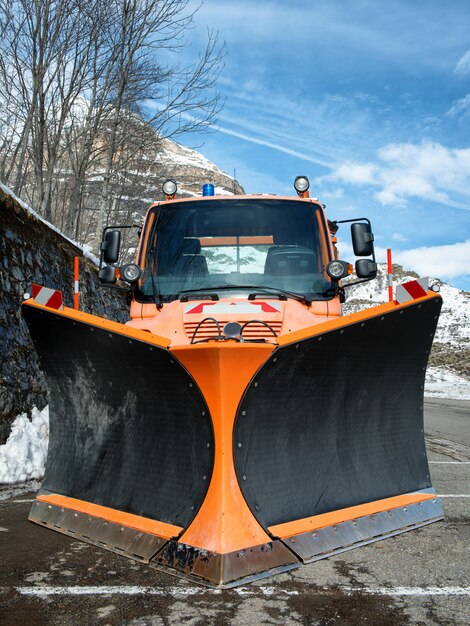 Premium Photo | Small orange truck using snow plow