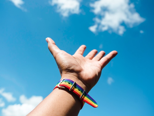 Premium Photo Small Rainbow Flag Belt On Gay People Wrist With Freedom Gesturing Up Into The 8322