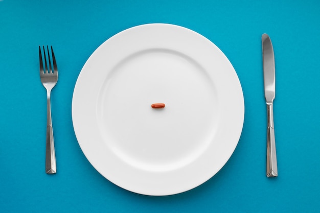 premium-photo-a-small-tablet-in-a-plate-medical-eat-pills-instead