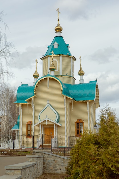 Premium Photo | A small town chapel in a park in the center of the city