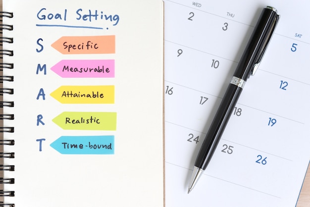Smart goals setting acronyms on the notebook with calendar Free Photo