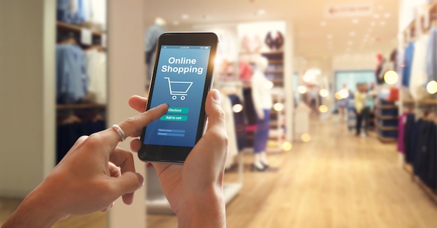  Smart phone online shopping in woman hand
