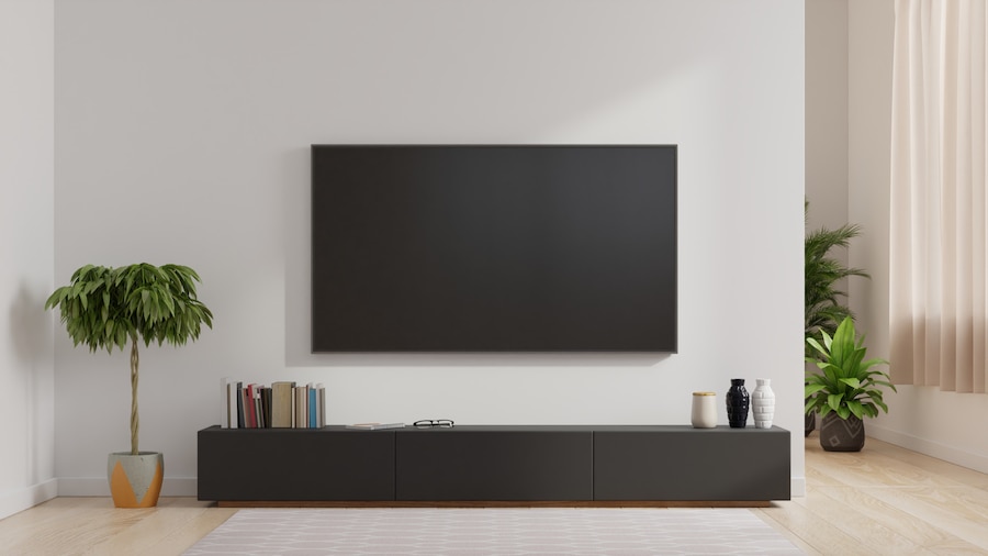 Premium Photo | Smart tv on the white wall in living room,minimal design.