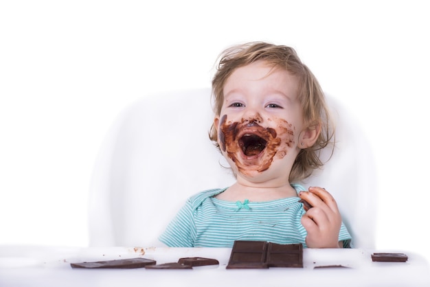 Premium Photo Smeared Baby Eating Chocolate