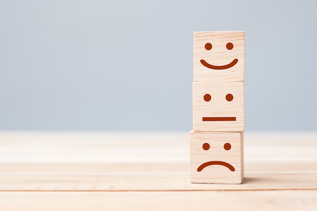 Premium Photo | Smile face symbol on wooden blocks